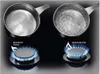 Two gas burners on a black stovetop, each with a pot of water. One pot is simmering, the other is boiling vigorously. Náhľad obrázku produktu