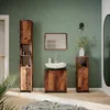 A modern bathroom with wooden furniture, a sink, and a mirror. Náhled obrázku produktu