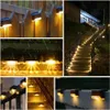 Collage of solar-powered outdoor lights installed on a fence, stairs, and a wall. Produktbild-Vorschau