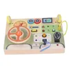 A wooden toy dashboard with various interactive elements for children. Náhled obrázku produktu