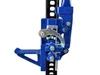 A close-up view of the mechanism of a blue and black farm jack, highlighting its lifting and locking components. Náhled obrázku produktu