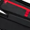 A close-up view of a black pencil case with a red zipper. Anteprima dell’immagine prodotto