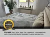 A bed with a grey patterned bedsheet, with a plant and window in the background. Produktbild-Vorschau