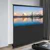 A projection screen displaying a city skyline at sunset, set up in a living room with curtains in the background. Voir les images du produit