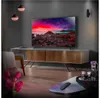 A modern living room with a large TV displaying a colorful landscape, a media console, and decorative items. Produktbild-Vorschau