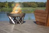 A fire pit on a wooden deck next to a lake. Produktbild-Vorschau