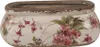 A ceramic planter with a floral design. Podgląd zdjęcia produktu