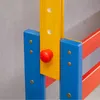 Close-up of a colorful wooden structure, likely part of a child's desk or play furniture, showing joints and fasteners. Produktbild-Vorschau