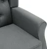 A close-up view of the armrest and seat of a gray fabric armchair. Podgląd zdjęcia produktu