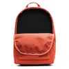 A front view of an orange Nike backpack with its main compartment open. Náhled obrázku produktu