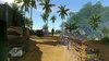 A first-person view of a video game scene set in a tropical environment with palm trees, sand, and military-style structures. Produktbild-Vorschau