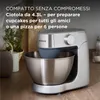 A silver Kenwood kitchen mixer with a stainless steel bowl on a wooden countertop. Produktbild-Vorschau