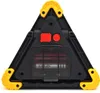 The back of a black and yellow triangular LED warning light with a transparent battery compartment showing batteries. Voir les images du produit
