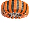 A close-up, top-down view of a car tire with orange snow chains attached. Náhled obrázku produktu