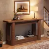 A wooden console table with decorative items and books, placed in a hallway next to a staircase. Podgląd zdjęcia produktu