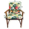 A chair cushion with a floral pattern is shown on a wooden chair, with dimensions indicated by arrows and numbers. Produktbild-Vorschau