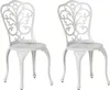 Two white ornate chairs are shown against a white background. Náhled obrázku produktu
