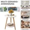 Collage showing a small round side table with sunflowers and a cup on top, and other lifestyle images of living room, bedroom, and flower shop settings. Produktbild-Vorschau