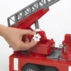 A hand is shown turning a white gear on a red toy fire engine. Náhled obrázku produktu