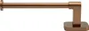 A copper-colored toilet paper holder on a white background. Produktbild-Vorschau