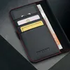 A close-up view of a black leather wallet case for an iPhone, showing card slots and a banknote. Produktbild-Vorschau