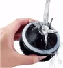 A hand is holding a blender blade assembly while water is being poured over it. Podgląd zdjęcia produktu