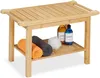 A bamboo stool with a shelf, holding towels and bottles. Voir les images du produit