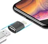 A close-up shot of a USB-C to Lightning adapter and a USB-A connector, with a smartphone in the background. Produktbild-Vorschau