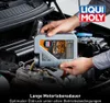 A person is pouring motor oil into a car engine. Produktbild-Vorschau