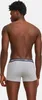 A man wearing grey boxer shorts with a navy blue waistband. Produktbild-Vorschau