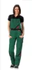 A woman is standing and posing in a pair of green overalls. Produktbild-Vorschau