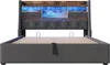 A bed with a headboard featuring storage compartments and LED lighting. Produktbild-Vorschau