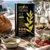 Olivenöldose auf gedecktem Tisch mit Brot und Oliven vor Meereskulisse Produktbild-Vorschau