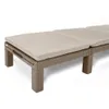 A close-up view of a section of a beige cushioned chaise lounge with a woven brown frame, set against a white background. Voir les images du produit