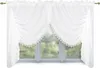 A white lace curtain is draped over a window with a blurred green background of trees. Náhled obrázku produktu