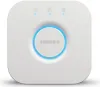 A white Philips Hue Bridge 2.1 smart home hub is shown on a white background. Produktbild-Vorschau
