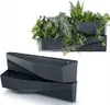 Two dark gray modular planters are shown. The top planter is filled with various green plants, while the bottom planter is empty and stacked below. Anteprima dell’immagine prodotto