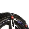 A close-up of a tire with snow chains attached. Náhľad obrázku produktu