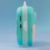 Side view of a teal and pink digital camera for children. Náhľad obrázku produktu