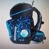 A navy blue and light blue patterned backpack with a character patch on the front. Voir les images du produit