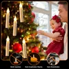 A father and daughter decorating a Christmas tree with flameless LED candles. Produktbild-Vorschau