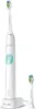 A white electric toothbrush with a charging base and an extra brush head. Produktbild-Vorschau