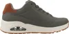 A side view of a single gray sneaker with a brown accent on the heel and a white sole. Voir les images du produit