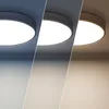 A collage showing a round LED ceiling light in three different color temperatures: cool white, neutral white, and warm white. Produktbild-Vorschau