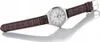 A watch with a brown leather strap is shown against a white background with a reflection. Produktbild-Vorschau