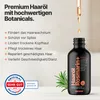 A bottle of hair oil with text and graphics highlighting its benefits and ingredients. Produktbild-Vorschau