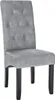 A single gray upholstered dining chair with dark wooden legs. Produktbild-Vorschau