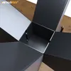 Close-up view of a star-shaped metal table base with wooden accents. Produktbild-Vorschau