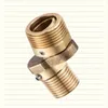 A brass plumbing fitting with threaded ends and a swivel joint, set against a lined background. Anteprima dell’immagine prodotto