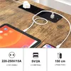 A close-up shot of a desk with a power strip and charging cables connected to a tablet and a smartphone. Anteprima dell’immagine prodotto